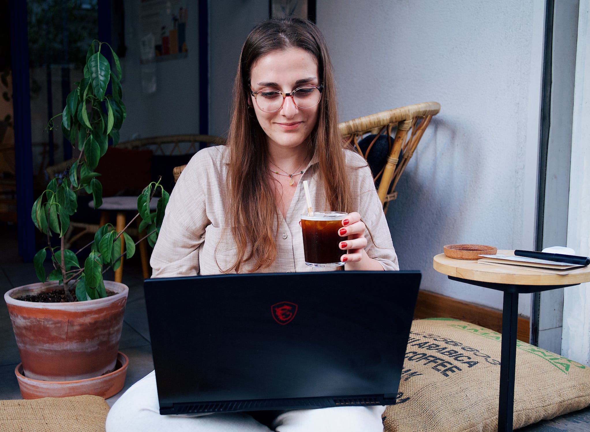 woman at laptop with coffee
